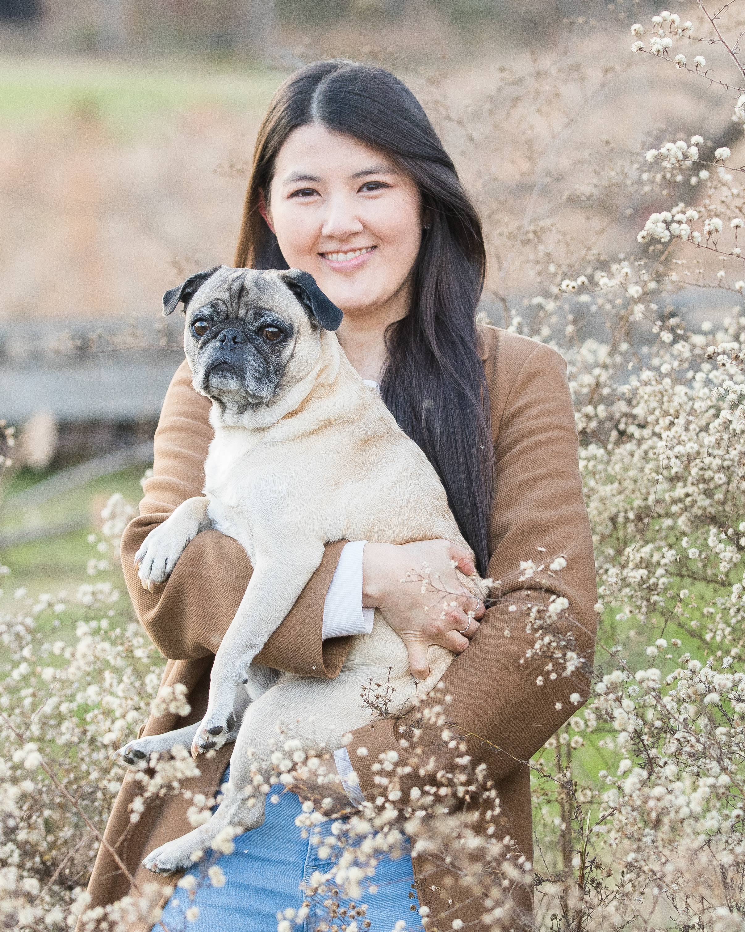 Yujiemi posing with her dog in her arms